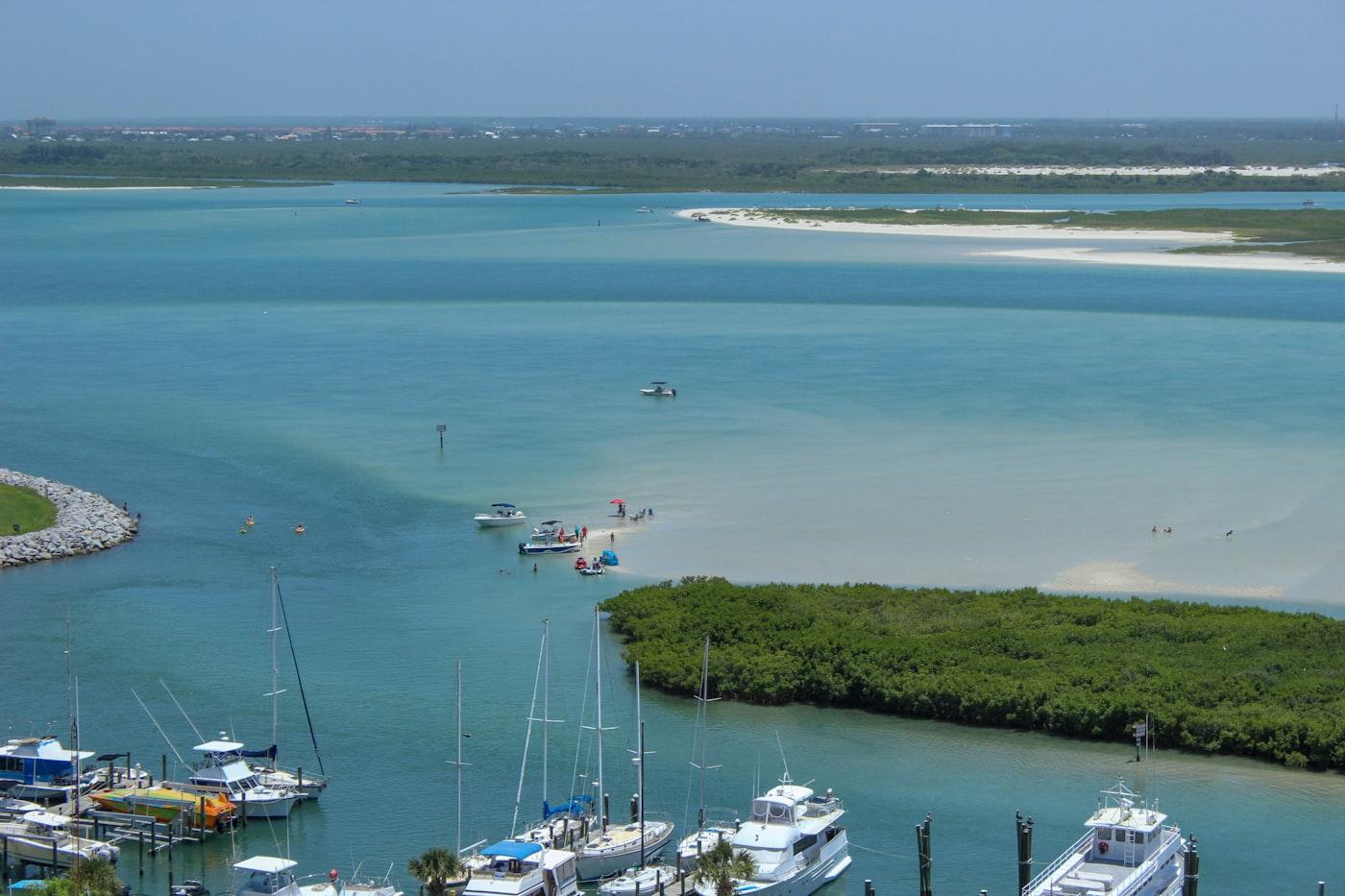 Boats anchored along a turquoise sandbar, Peanut Island